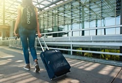 girl walking with suitcase