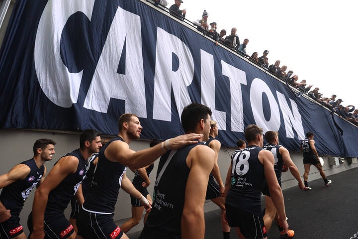 MELBOURNE, AUSTRALIA - APRIL 03: The Blues head out during the round three AFL match between the Carlton Blues and the Hawthorn Hawks at Melbourne Cricket Ground on April 03, 2022 in Melbourne, Australia. (Photo by Robert Cianflone/Getty Images via AFL Photos)