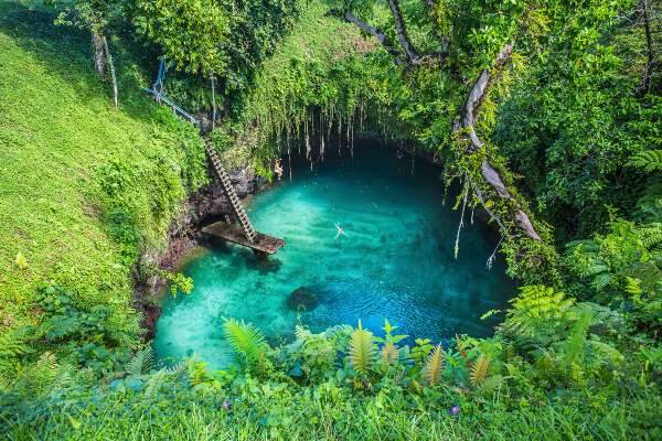 Blue water lagoon in rainforest in Samoa