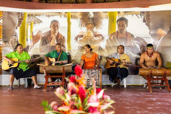 Samoan locals playing guitar at musical performance