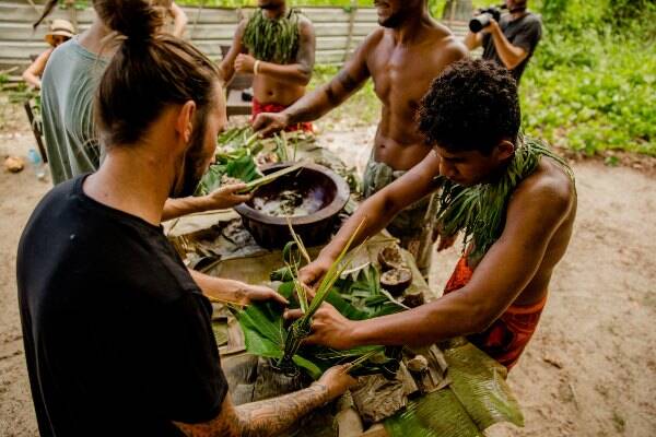Locals teaching visitors crafting in Samoa