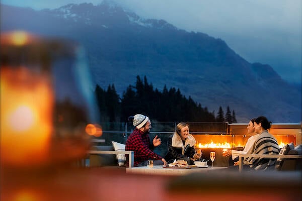 A group of friends chatting in a winter setting