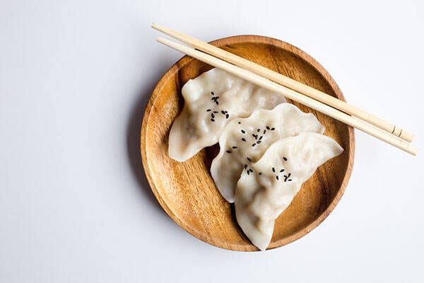 dumplings and chopsticks on plate