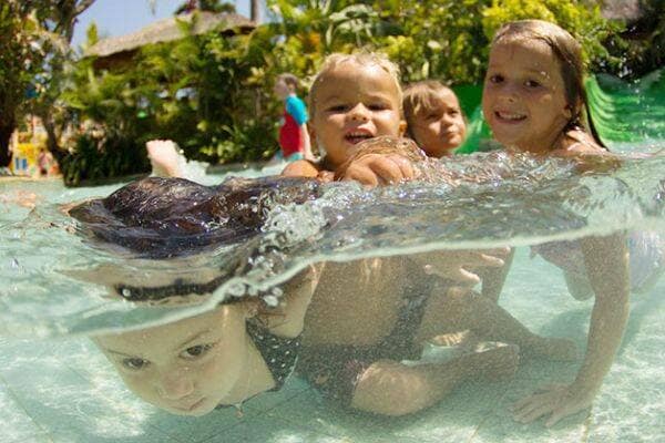 Kids swimming at Waterbom water park in Kuta, Bali