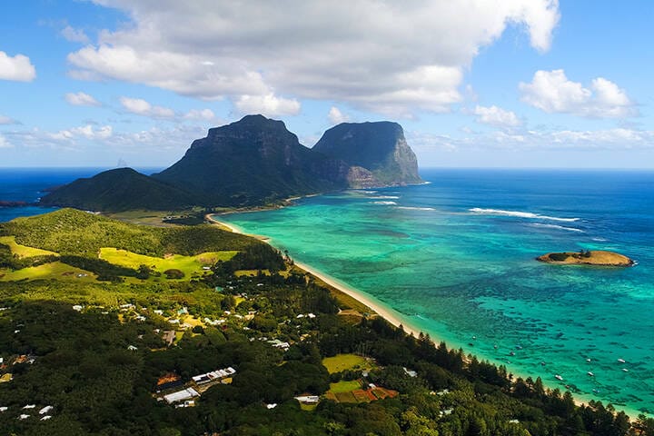 Aerial view of Lord Howe Island (World Heritage-listed paradise), turquoise blue lagoon and Mount Gower on background - New South Wales - Tasman Sea - Australia from above