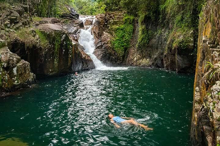 Lady swimming in a rock pool at Finch Hatton Gorge