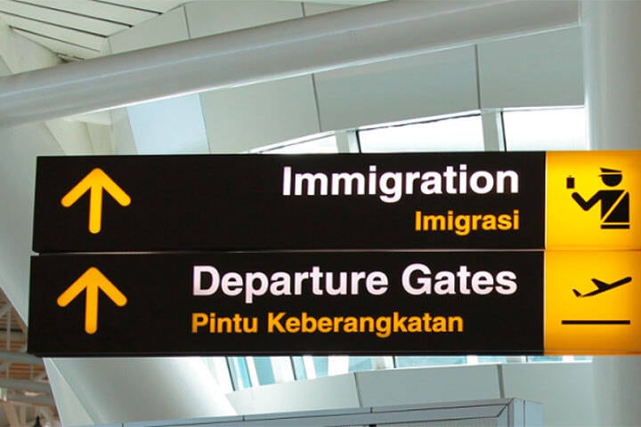 Signs written in English and Indonesian at Denpasar Airport 