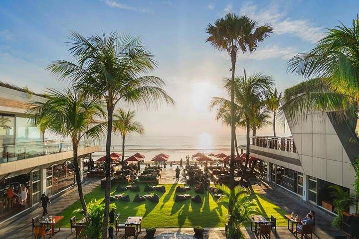 Aerial view of umbrellas and swimming pool at Ku De Ta Beach Club, Kuta