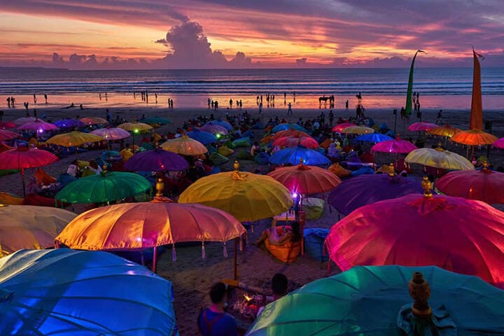 View of colourful umbrellas on the sand at La Plancha Beach Club, Seminyak