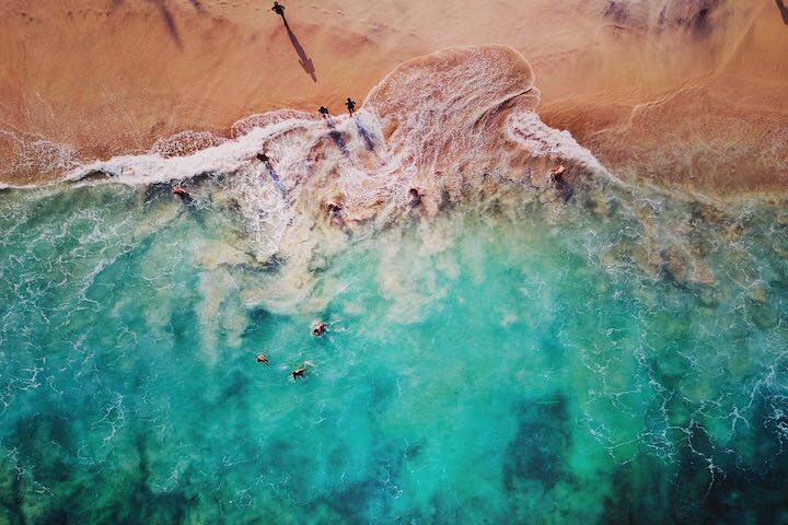 Aerial view of ocean and shore of Bias Tugel Beach, Bali