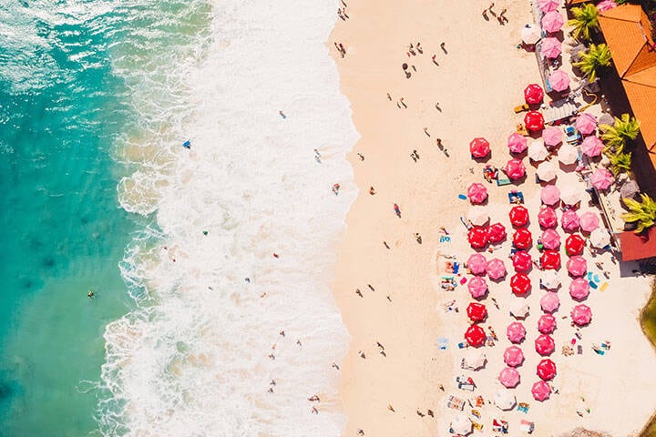 Aerial view of colourful umbrellas at Dreamland Beach, Bali
