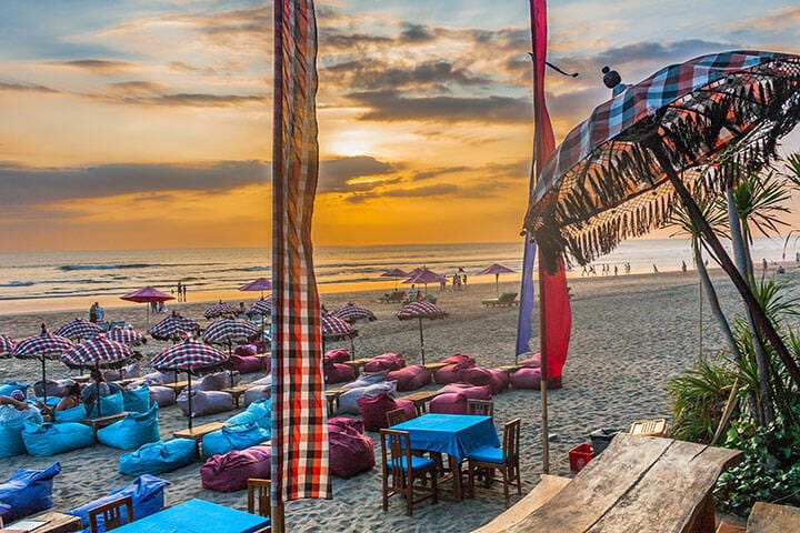 Beach umbrellas and bean bags at Legian Beach in  Bali