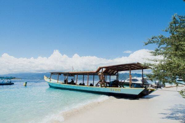 Scuba diving boat on the beach at Gili Trawanga by Uber Scuba Gili