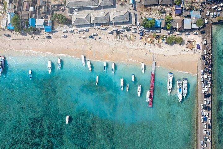 Beautiful Top Down Drone Shot of Ships on Toya Pakeh Harbour. Nusa Penida, Bali - Indonesia