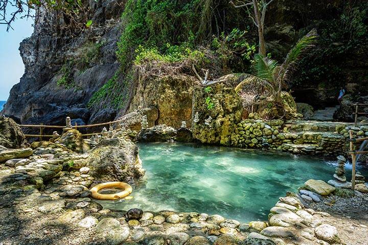 Beach and cave at Tembeling beach, at Nusa Penida Island, Bali Indonesia