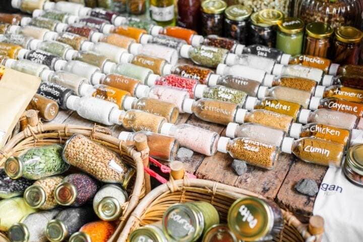 Jars of fresh herbs and spices on display at Canggu Sunday Market, Bali