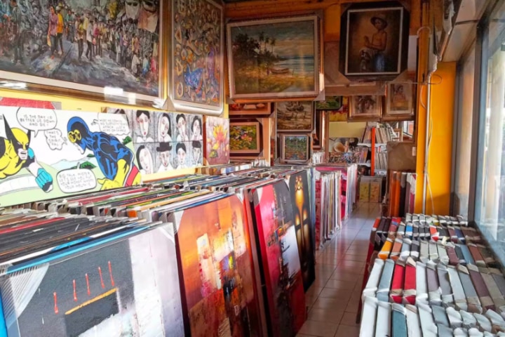 Canvases and art paintings on display in shop at Kumbasari Art Market, Bali