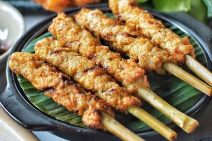 Freshly cooked satay chicken skewers at Blambangan Senggol Night Market Kuta, Bali