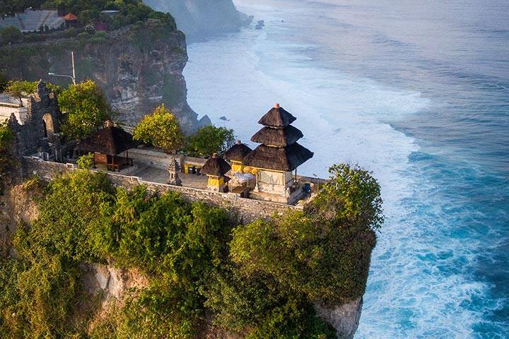 Uluwatu Temple on clifftop overlooking ocean at Uluwatu, Bali
