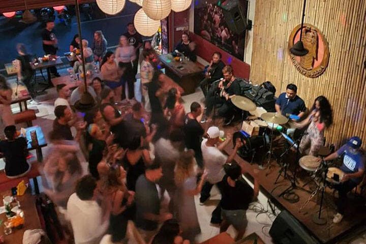 Patrons dancing and having fun watching a live band at Laughing Buddha, Ubud, Bali