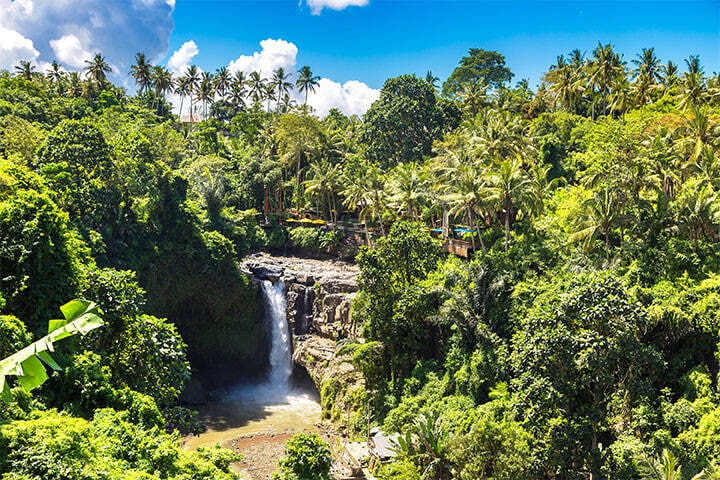 Panoramic view of Tegenungan Waterfall near Ubud in Bali, Indonesia on a sunny day