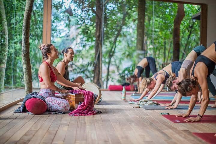 Instructors teaching class of women at Radiantly Alive Ubud, Bali