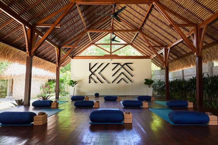 Outdoor yoga studio setup for morning yoga with mats and blocks at Yoga Searcher Uluwatu, Bali 