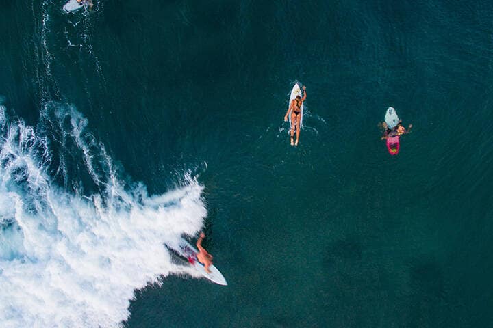 Surfers out in the water in Canggu
