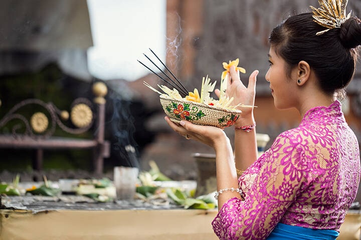 Balinese woman during praying