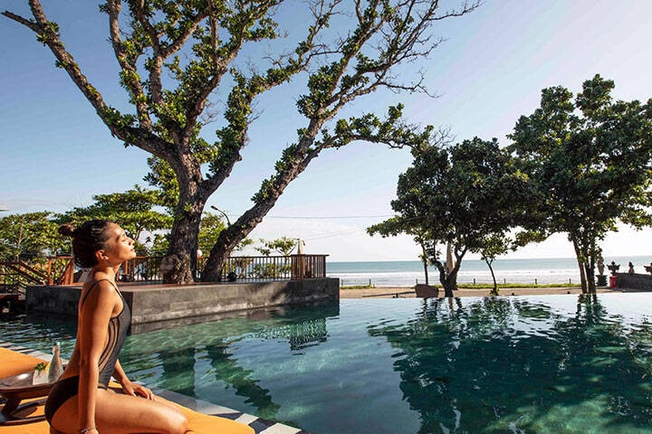 Traveller relaxing at Seminyak resort in Bali, Indonesia