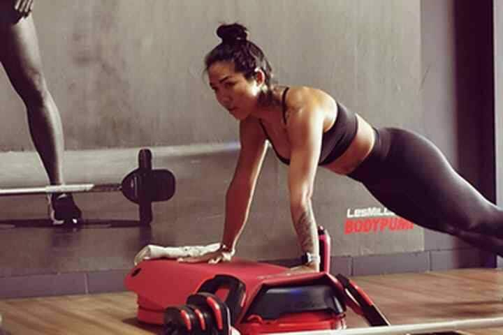 Woman doing push up on elevate block in gym at Bali Fitness, Seminyak