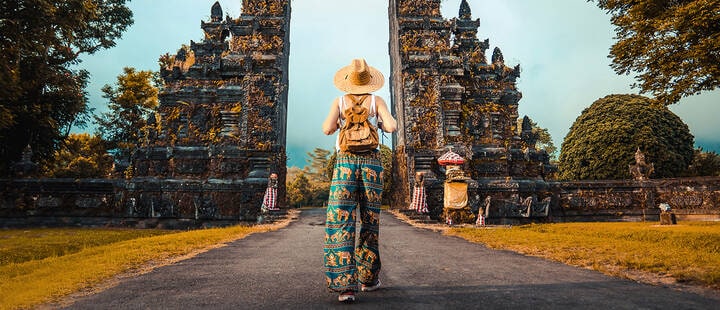 Woman with backpack exploring Bali, Indonesia. 