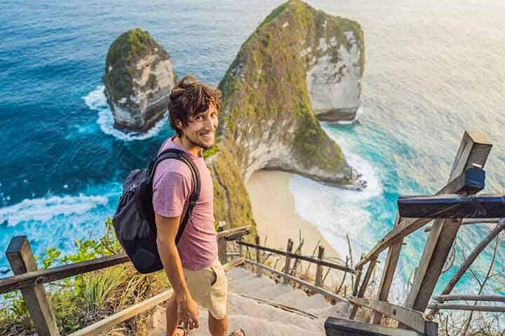 Man in Nusa Penida Bali Wearing Casual Shirt, Boardshorts and Flip Flops