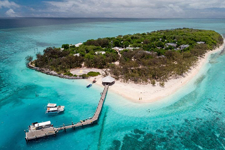 Island surrounded by bright blue water in Gladstone