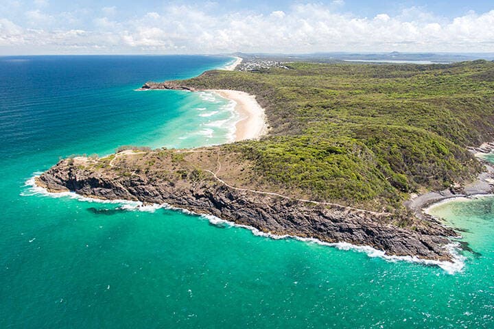 Aerial view of island and mountains by the beach in Sunshine Coast