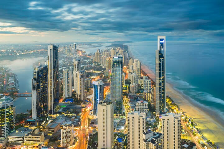 Aerial view of modern buildings with light trail at riverside at Gold Coast, Australia during sunset