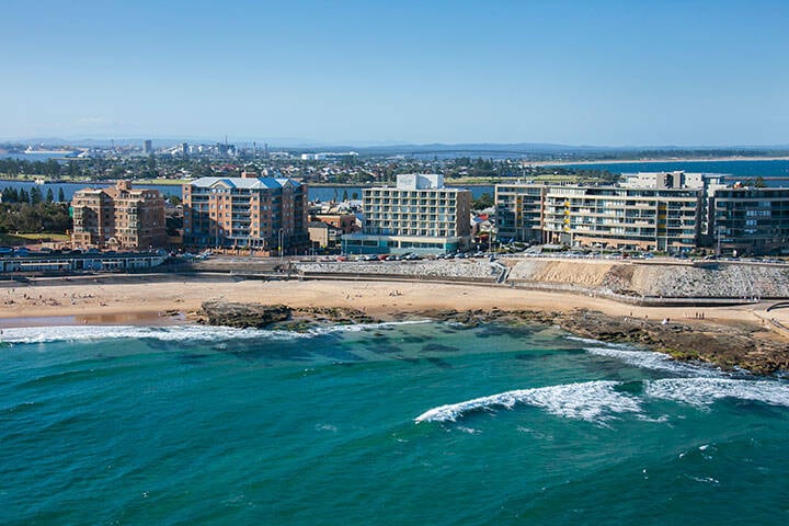 Coastal aerial of Newcastle Beach and township. 