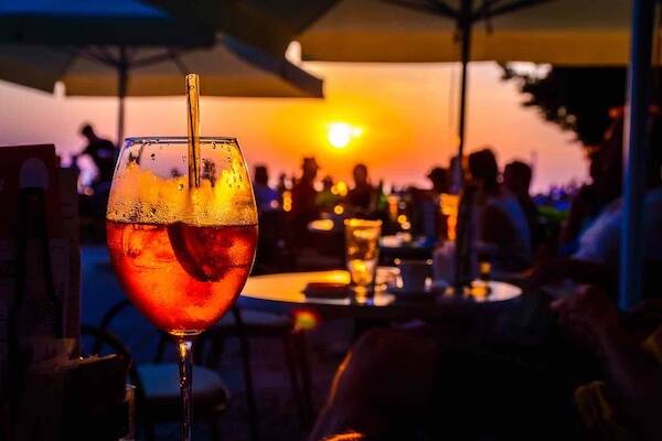 Sunset drinks overlooking beach in Samoa
