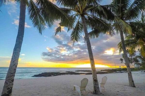 Sunset on beach with palm trees, Samoa