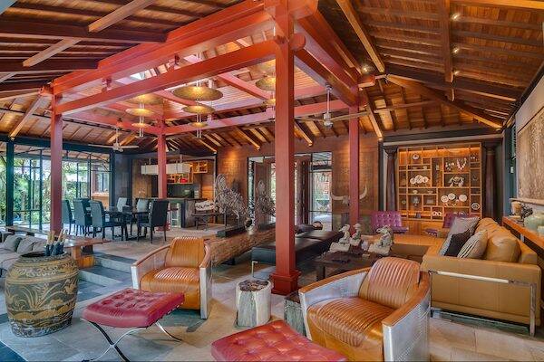 Indoor lounging area with leather couches at the Villa Conti, Bali