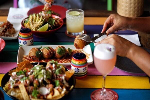 Tacos and empanadas on table where guests are enjoying their lunch at Hot Tamale in Darwin.