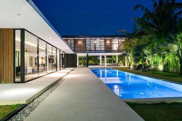 Luxurious outdoor private pool lit up at night at Villa La Dacha, Bali