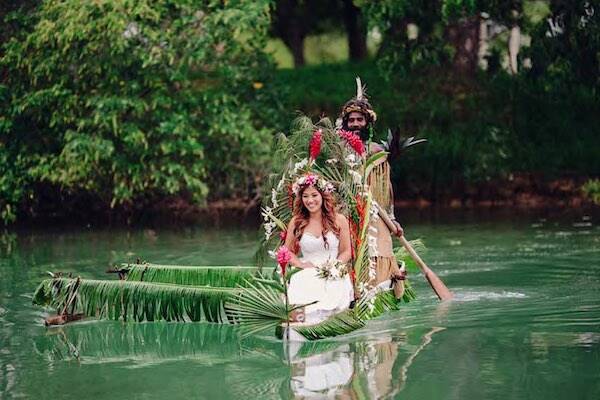 Newlywed in boat floating over water lagoon in Vanuatu