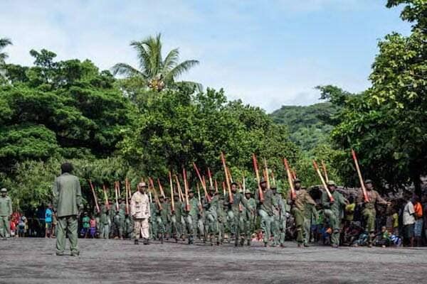Locals dressed in military wear for John Frum Day activities, Vanuatu