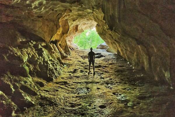 Visitor standing in Millenium Cave, Vanuatu 