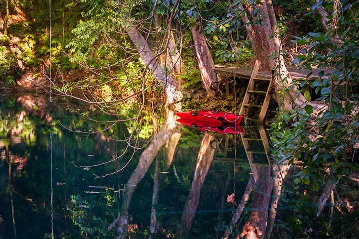 Red kayak on a river in Vanuatu