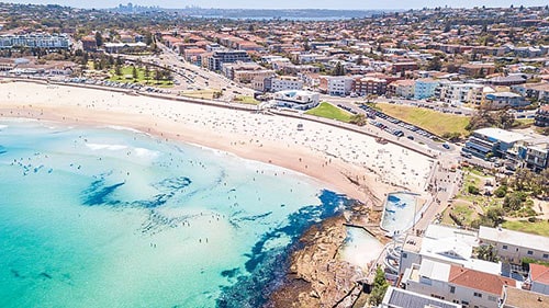 Birds eye view of Bondi Beach on a beautiful summer's day. Melbourne to Sydney flights - things to do.