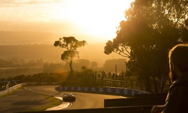 Car driving on Bathurst track at sunset