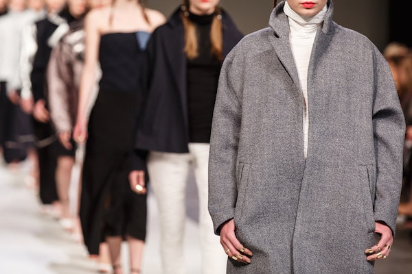 Models wearing coats on runway