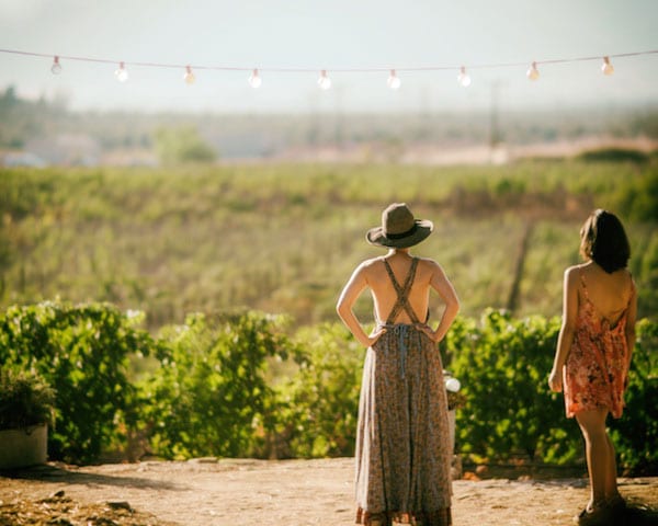 Two women in wine fields
